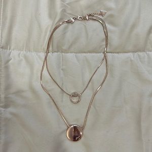 Guess necklace in rose gold tone.